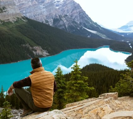 man sitting near lake 3572740