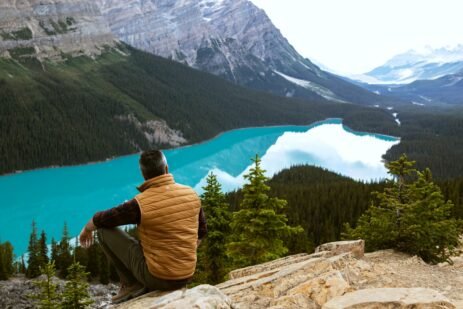 man sitting near lake 3572740