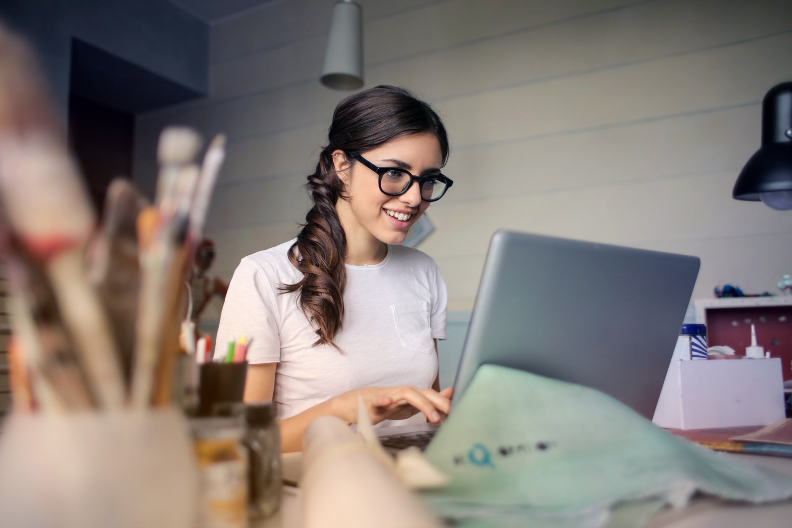 An exciting, hilarious, extremely outlandish, oftentimes touching 2 photo of woman using her laptop 935756